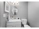 Traditional style bathroom features updated vanity with marble countertop, new faucet and updated light fixture at 3638 Fieldstone Ln, Plainfield, IN 46168