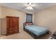 Cozy bedroom with a bed, dresser, and window, perfect for a room at 3638 Fieldstone Ln, Plainfield, IN 46168