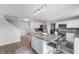 Modern kitchen with white cabinets, stainless steel appliances, granite countertops, and a large island with seating at 3638 Fieldstone Ln, Plainfield, IN 46168