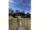 Exterior view of a cozy home with a spacious backyard and a trampoline for recreation at 3752 N Oxford St, Indianapolis, IN 46218