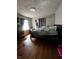 Cozy bedroom features hardwood floors, and a comfortable bed, creating a relaxing retreat at 3752 N Oxford St, Indianapolis, IN 46218
