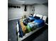 Spacious bedroom featuring a modern bed frame and unique wall decorations for a cozy retreat at 3752 N Oxford St, Indianapolis, IN 46218