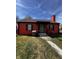 Charming orange single-story home featuring a welcoming front porch and well-maintained front yard at 3752 N Oxford St, Indianapolis, IN 46218