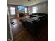 Cozy living area boasting hardwood floors, a stone fireplace, and a comfortable sectional sofa at 3752 N Oxford St, Indianapolis, IN 46218