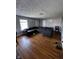 Spacious living room with hardwood flooring, light gray walls, and a comfortable sectional sofa at 3752 N Oxford St, Indianapolis, IN 46218