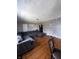 Inviting living room features hardwood floors, neutral gray walls, and a comfortable gray sectional at 3752 N Oxford St, Indianapolis, IN 46218