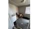Room featuring a deep freezer, window with blinds, and other storage items, providing functional space at 3752 N Oxford St, Indianapolis, IN 46218
