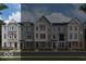 Charming townhomes featuring a mix of siding and brick, with ample windows and a welcoming facade at 412 Elite St # 2-601, Westfield, IN 46074