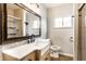 Stylish bathroom with a marble countertop, sleek sink, and walk-in shower at 4435 E 38Th St, Indianapolis, IN 46218