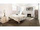 Bedroom with a stone fireplace, hardwood floors, and decor at 4435 E 38Th St, Indianapolis, IN 46218