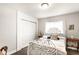 Bright bedroom featuring an ornate metal bed frame, closet, and stylish decor at 4435 E 38Th St, Indianapolis, IN 46218