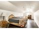 Attic bedroom featuring a dormer window, wood floors, and stylish decor at 4435 E 38Th St, Indianapolis, IN 46218