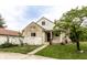Charming home with stone and siding, white picket fence, and landscaped yard at 4435 E 38Th St, Indianapolis, IN 46218
