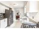 Bright, updated kitchen with white cabinetry, stainless steel appliances, and a functional layout at 4435 E 38Th St, Indianapolis, IN 46218