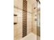 Bathroom shower featuring elegant tile work, a shower head and sleek hardware at 4435 E 38Th St, Indianapolis, IN 46218