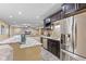 View of the bar area with stainless steel appliances and view of the lounge area at 4681 Shelby Cir, Greenwood, IN 46143