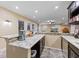 A basement wet bar area with granite counter tops and a view to the sitting area at 4681 Shelby Cir, Greenwood, IN 46143