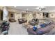 The basement is carpeted and features plenty of seating, as well as a ping pong table and kitchenette at 4681 Shelby Cir, Greenwood, IN 46143