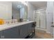Bathroom with double vanity, modern fixtures, and glass-enclosed shower stall at 4681 Shelby Cir, Greenwood, IN 46143