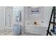 Bathroom featuring soaking tub, shower, and modern decor for a relaxing and spa-like experience at 4681 Shelby Cir, Greenwood, IN 46143