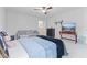 This bedroom offers lots of natural light, a comfy couch, a ceiling fan, and a soft carpet at 4681 Shelby Cir, Greenwood, IN 46143