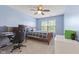 This bedroom offers lots of natural light, a ceiling fan, and soft carpet as well as furniture at 4681 Shelby Cir, Greenwood, IN 46143