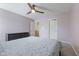 This bedroom features carpet, neutral paint, ceiling fan, and two closets with a bed set as well at 4681 Shelby Cir, Greenwood, IN 46143