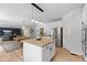 Modern kitchen featuring white cabinets, granite countertops, stainless steel appliances, and an island with bar stool seating at 4681 Shelby Cir, Greenwood, IN 46143