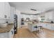 Modern kitchen featuring white cabinets, granite countertops, stainless steel appliances, and an island with bar stool seating at 4681 Shelby Cir, Greenwood, IN 46143