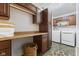This laundry room offers extra cabinet space as well as countertop space above the washer and dryer hookups at 4681 Shelby Cir, Greenwood, IN 46143