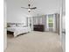 Spacious main bedroom with large windows, ceiling fan, and ample natural light at 4681 Shelby Cir, Greenwood, IN 46143