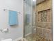 Bathroom featuring a walk-in shower with glass door and tiled niche at 4681 Shelby Cir, Greenwood, IN 46143