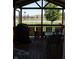 Enjoy this lovely view from the back porch, complete with dining table, chairs, and outdoor grill at 5101 W Bay Rd, Plainfield, IN 46168