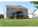Expansive backyard featuring a large covered deck, perfect for outdoor relaxation at 5101 W Bay Rd, Plainfield, IN 46168