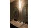 Stylish bathroom featuring double sinks, decorative mirrors, modern fixtures, and tiled wall accents at 5101 W Bay Rd, Plainfield, IN 46168