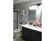 Modern bathroom featuring double vanity, stylish fixtures, and shower with glass door at 5101 W Bay Rd, Plainfield, IN 46168