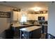Well-lit kitchen with white cabinets, stainless steel appliances, and a center island at 5101 W Bay Rd, Plainfield, IN 46168