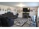 Cozy living room with a large sofa, fireplace, and modern decor at 5101 W Bay Rd, Plainfield, IN 46168