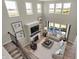 Open-concept living room with high ceilings, large windows, and modern furnishings at 5264 Summerton St, McCordsville, IN 46055