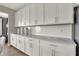 Bright kitchen with white cabinets, subway tile backsplash, and ample counter space at 5267 Summerton St, McCordsville, IN 46055