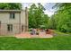 Enjoy this private backyard deck with outdoor seating, barbecue grill, and wooded views at 5412 Green Hills Dr, Brownsburg, IN 46112