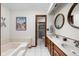 Well-lit bathroom with double vanity, tub, and separate shower at 5412 Green Hills Dr, Brownsburg, IN 46112
