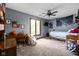 Bright and colorful bedroom with a ceiling fan, large window, and comfortable beanbag chair at 5412 Green Hills Dr, Brownsburg, IN 46112