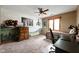 Bedroom with creative wall art and a ceiling fan; well-lit by a window at 5412 Green Hills Dr, Brownsburg, IN 46112