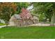 Spacious home featuring a well-maintained lawn, brick facade, and fenced-in backyard at 5412 Green Hills Dr, Brownsburg, IN 46112