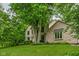 Two-story home boasts lush lawn and mature trees adding privacy and curb appeal to this beautiful property at 5412 Green Hills Dr, Brownsburg, IN 46112