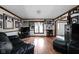 Spacious living room with hardwood floors, natural light, and ample space for entertaining guests at 5412 Green Hills Dr, Brownsburg, IN 46112