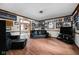 Open living room featuring hardwood floors, neutral walls, and a comfortable seating arrangement at 5412 Green Hills Dr, Brownsburg, IN 46112