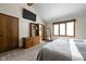 Comfortable primary bedroom with large windows and ensuite bathroom at 5412 Green Hills Dr, Brownsburg, IN 46112