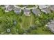 A high angle showing the large manicured backyard with patio and outdoor fireplace at 543 Amersham Ct, Avon, IN 46123